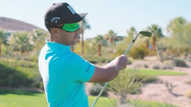 Xander Schauffele golfing while blindfolded