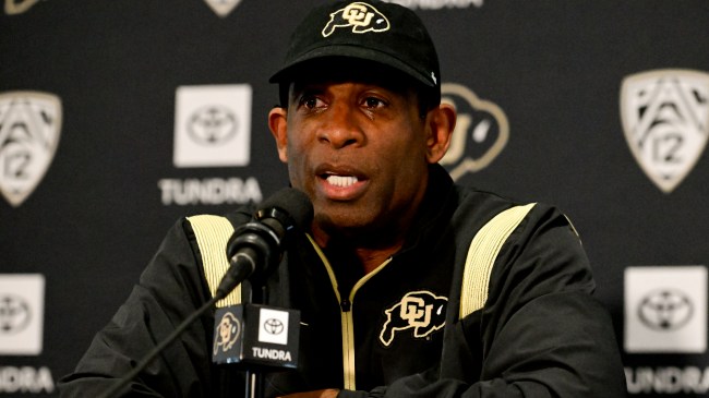 Deion Sanders speaks at a press conference.