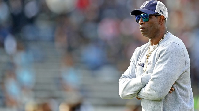 Deion Sanders looks onto the field.