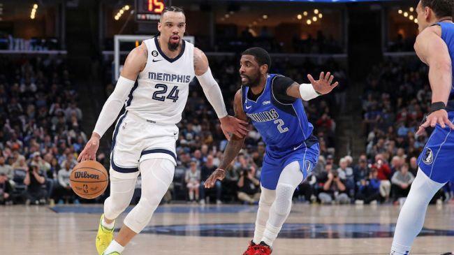 kryie irving and dillon brooks playing basketball