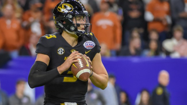 Drew Lock throws a pass against Texas.