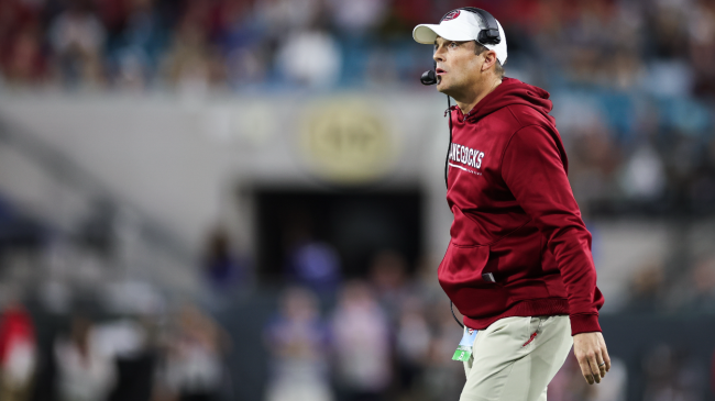 Shane Beamer calls onto the field.