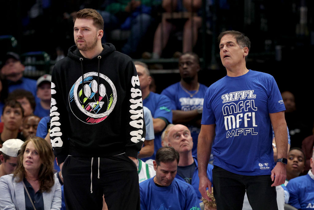 Mark Cuban and Luka Doncic on the bench