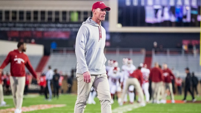 Brent Venables walks onto the field.