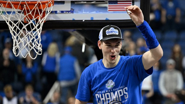 Kyle Filipowski celebrates Duke's ACC Tournament Championship.