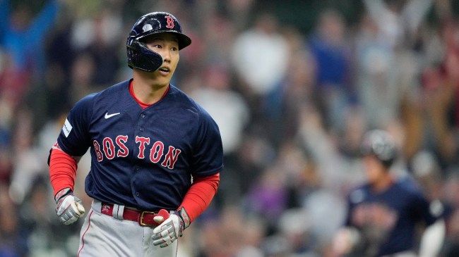 Masataka Yoshida rounds the bases after hitting a home run.