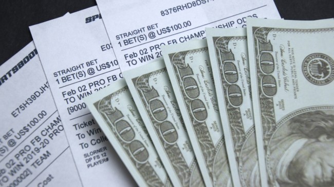 A number of betting slips accompanied by cash.