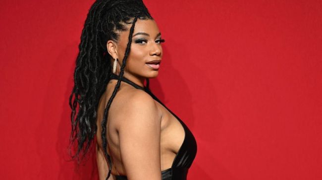 taylor rooks in a black dress