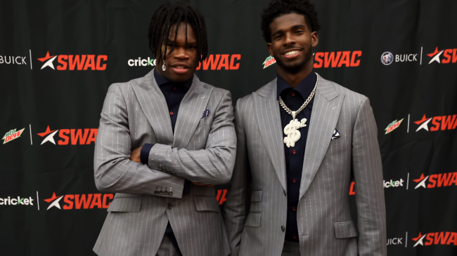 Teammates Travis Hunter and Shedeur Sanders pose for a photo.