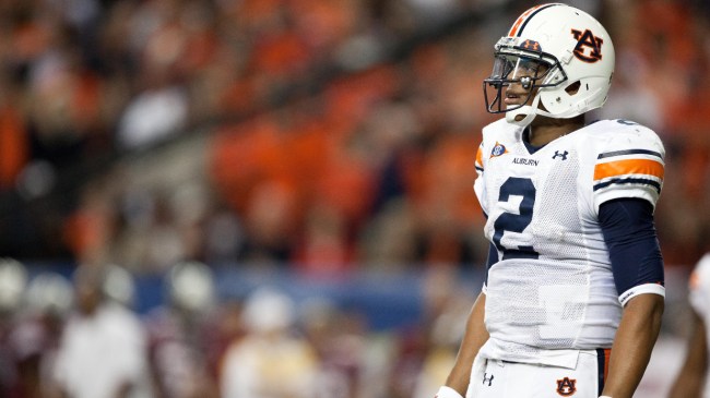 Cam Newton stands on the field during the SEC Championship Game.