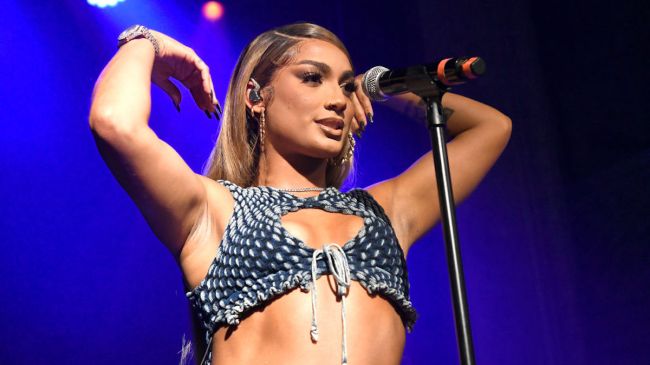 danileigh performing a song on stage