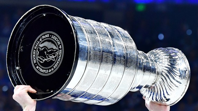 NHL player raising the Stanley Cup
