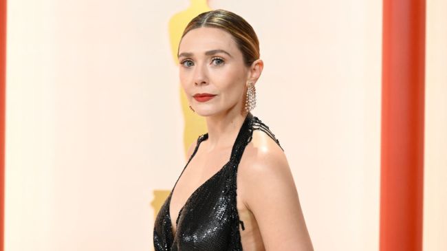 elizabeth olsen in a black dress on the red carpet
