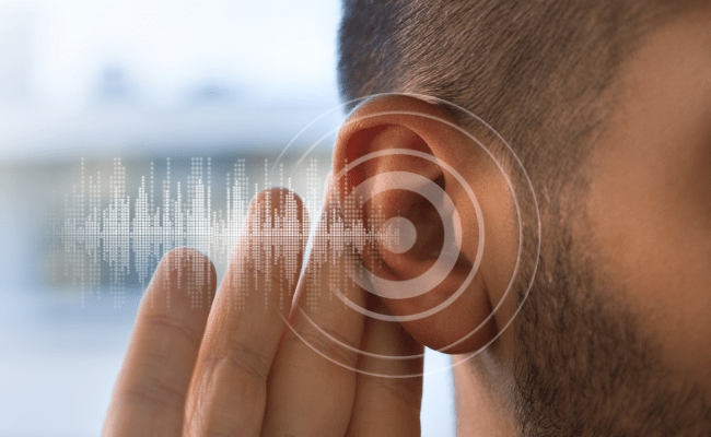 man listening ear audio illusion green needle brainstorm
