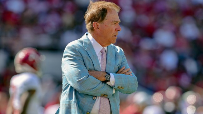 Nick Saban stands on the field before an Alabama football game.