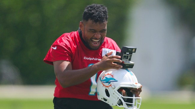 Tua Tagovailoa playing with a camera on his helmet