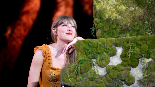Taylor Swift sits at a piano