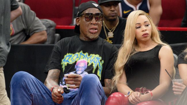 dennis rodman and girlfriend at basketball game