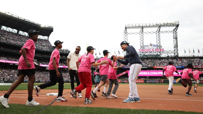 Kids run onto the field at the Home Run Derby.