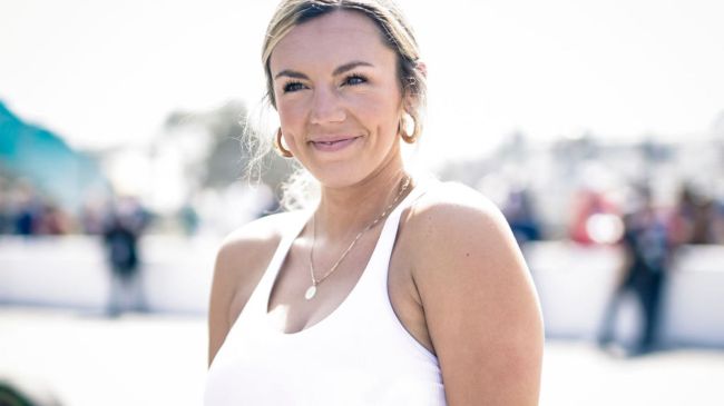 annie agar in a white tank top