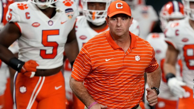 Dabo Swinney runs onto the field for the Orange Bowl.