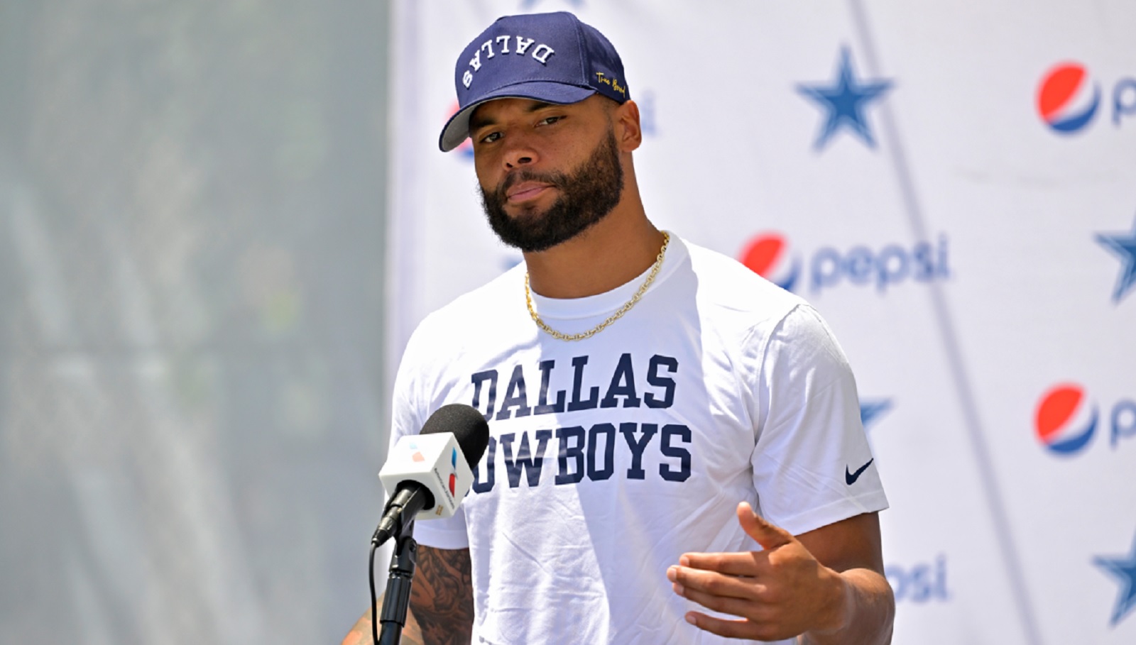 Dak Prescott addressing the media