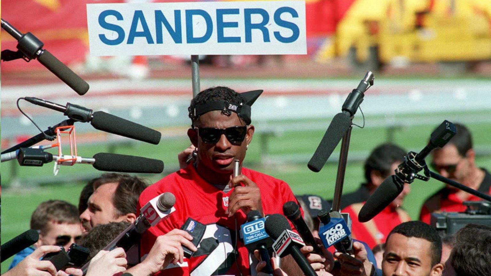 Deion Sanders meeting with media members in 1995