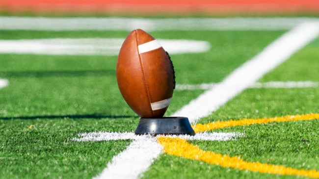 A football sits on a tee.