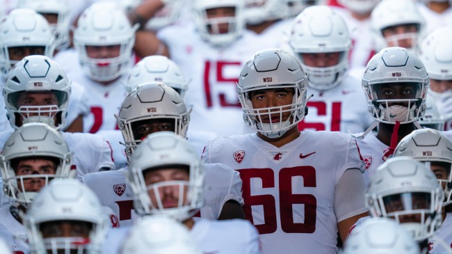 Washington State football players come out of the tunnel before a game.