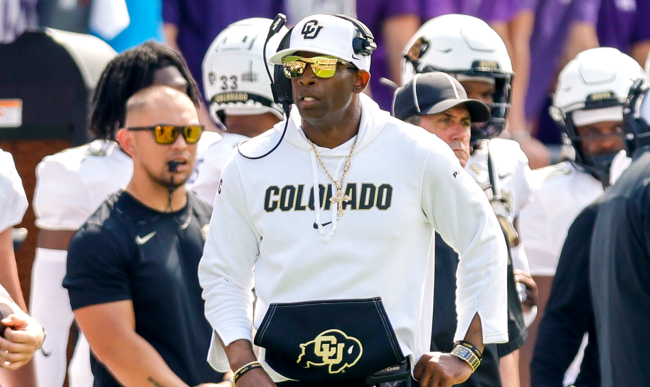 Deion Sanders watches from the sidelines