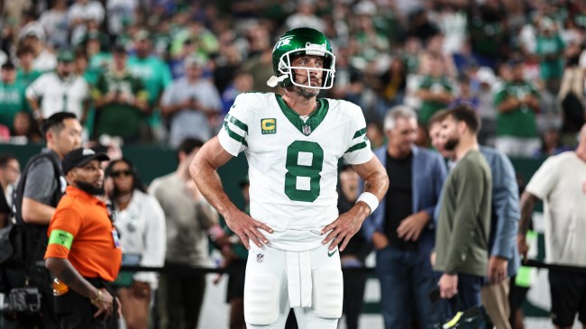Aaron Rodgers stands on the field before a MNF matchup between the Jets and the Bills.
