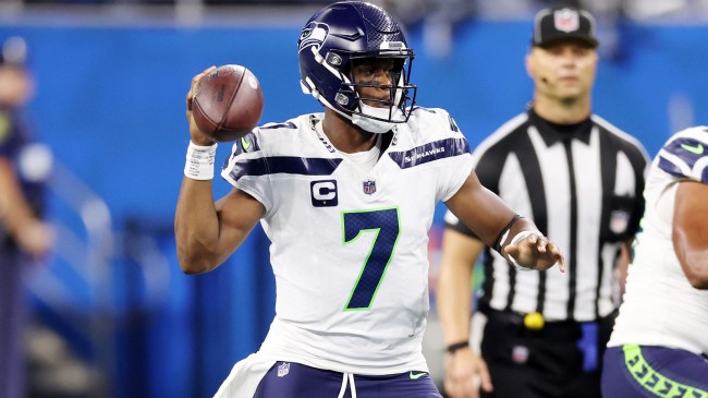 Geno Smith looks to throw a pass against the Lions.