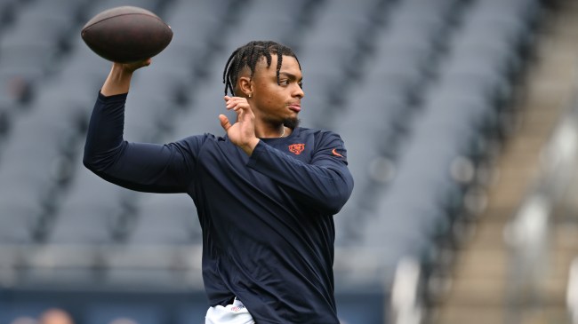 Justin Fields warms up before a Chicago Bears game.