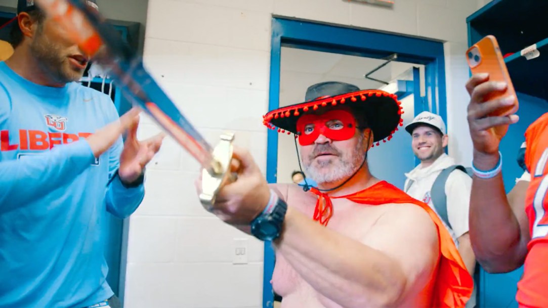 Liberty Football postgame locker room celebration bull fight buffalo