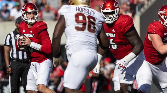 The Louisville Cardinals offense runs a play against Boston College.