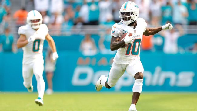 tyreek hill running with the footballl