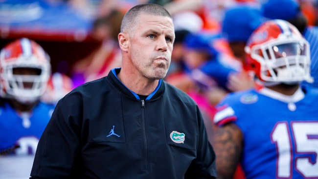 Billy Napier walks onto the field with the Florida Gators football team.