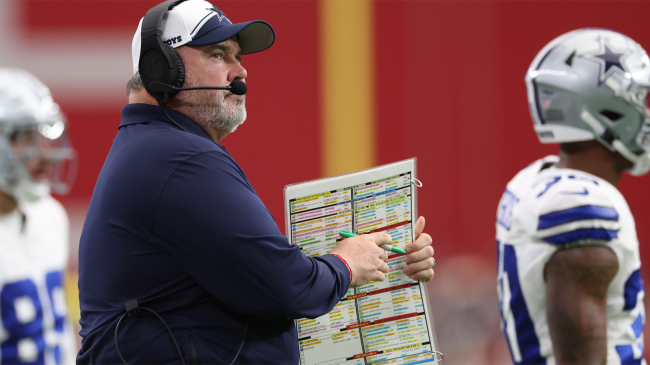 dallas cowboys coach mike mccarthy holds play call sheet