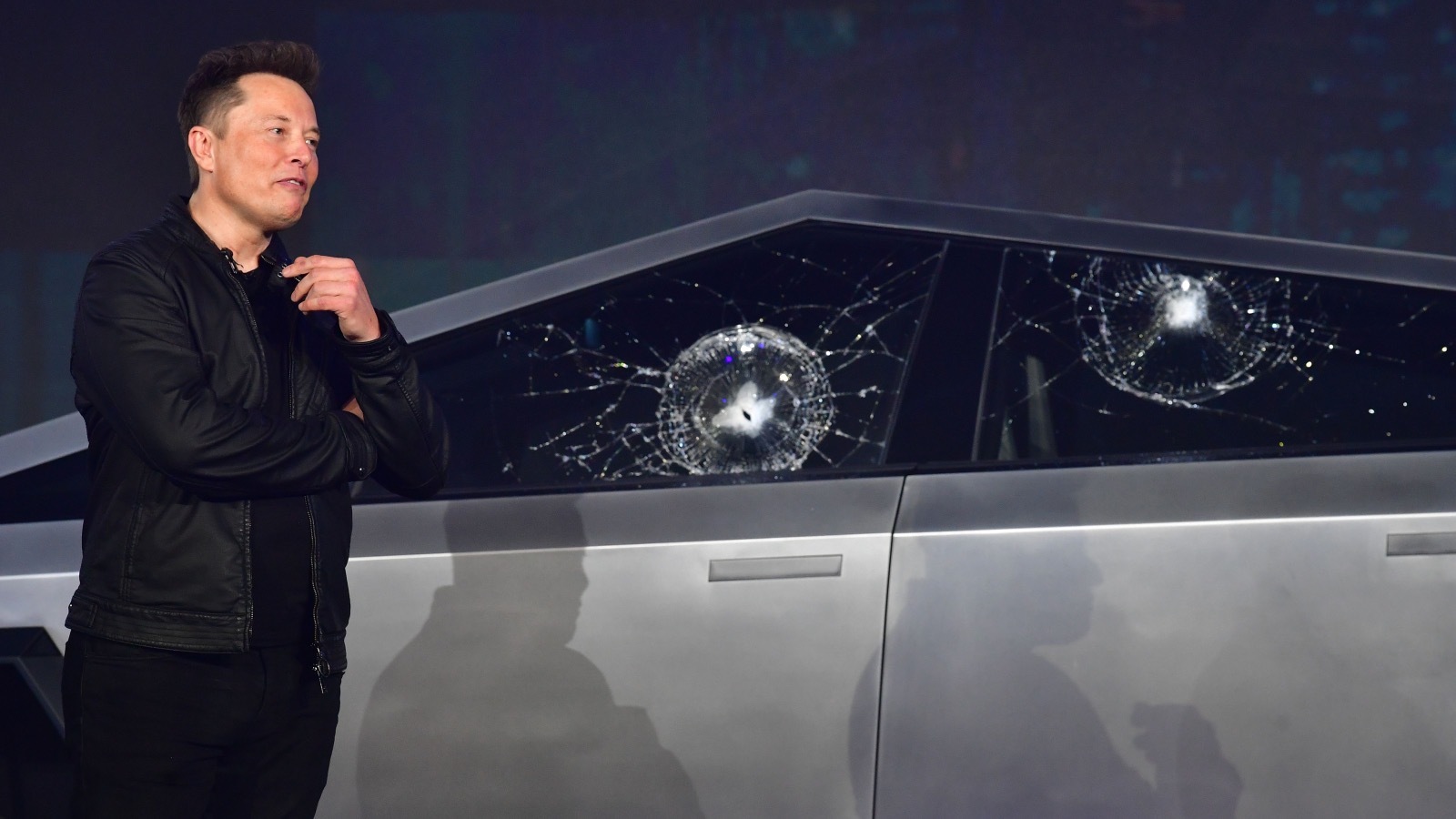 Elon Musk standing next to Tesla Cybertruck