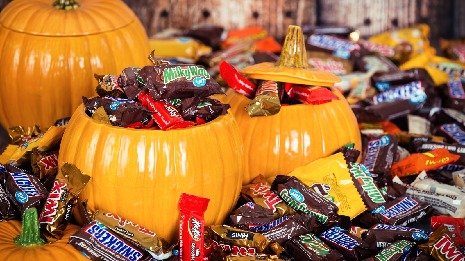 Halloween candy inside pumpkin containers