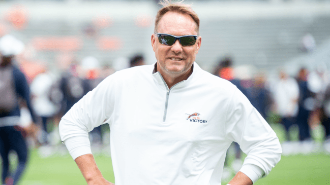 Hugh Freeze on the field before an Auburn football game.