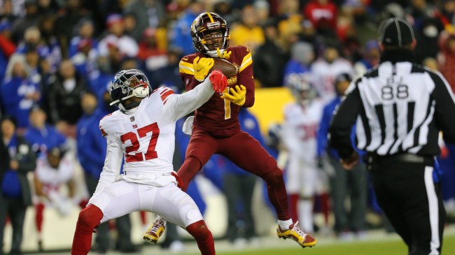 Jahan Dotson makes a catch over a Giants defender.
