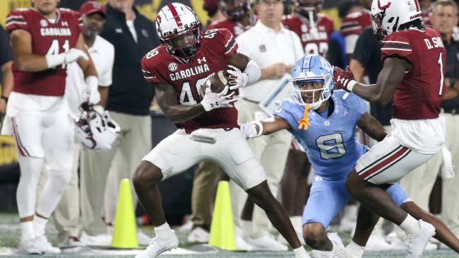 Kajuan Banks makes an interception in a game between South Carolina and North Carolina.