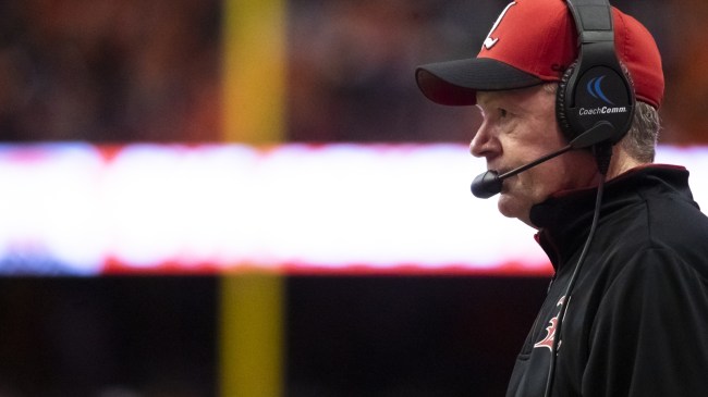 Bobby Petrino coaches from the sideline during a Louisville game.