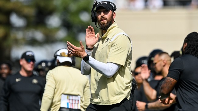 Offensive coordinator Sean Lewis reacts to a play on the sidelines.