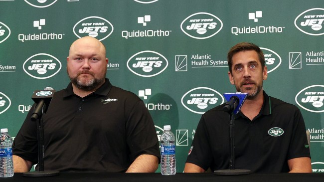 aaron rodgers and joe douglas at a press conference