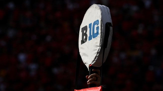 A Big Ten logo on a first down marker.