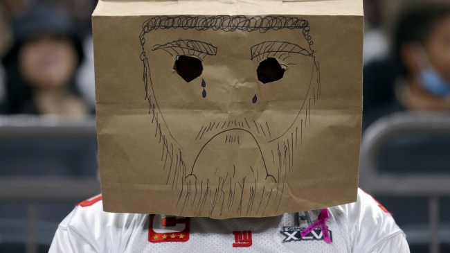 A sad Giants fan watches as New York takes on the Saints.