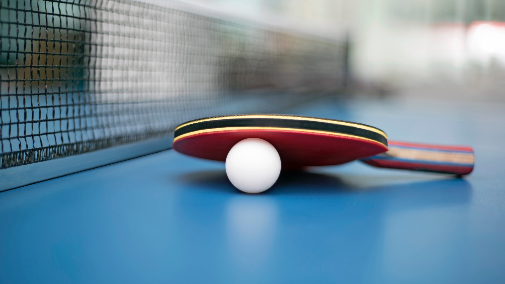 Table tennis racket with ball
