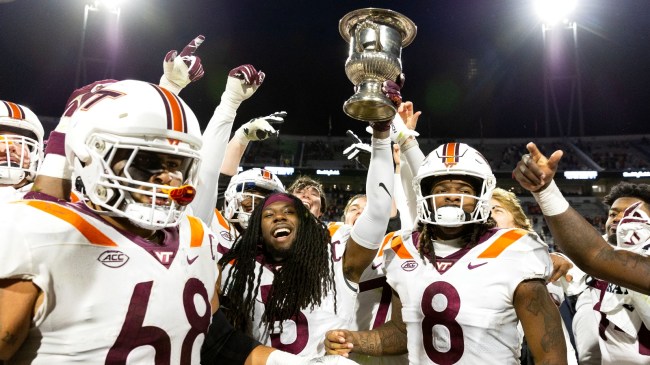 Virginia Tech players celebrate a rivalry win over Virginia.